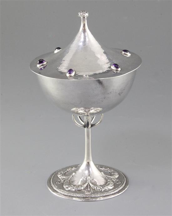 A good Edwardian Arts & Crafts gem set silver cup and cover, by Guild of Handicrafts Ltd, possibly from a design by C.R. Ashbee,